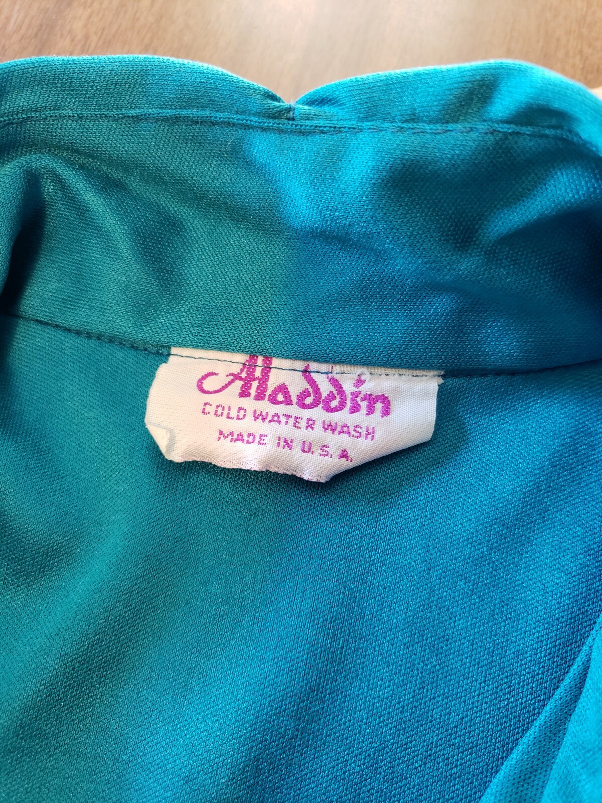 1970’s 80’s women’s rockabilly Mod shiny blue vintage top size S. Aladdin.