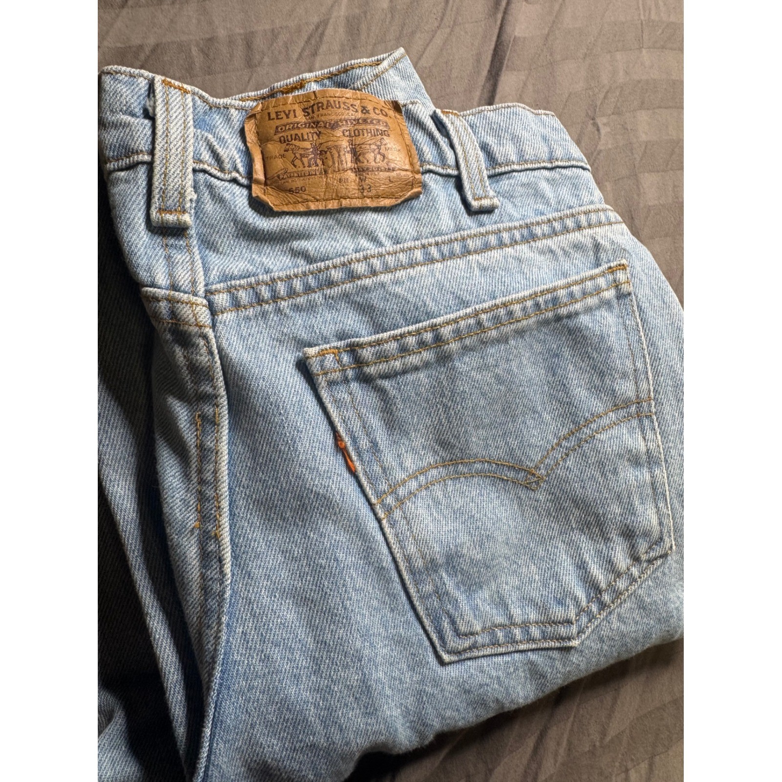 Vintage Levis 550 Orange Tab Light Wash Relaxed Tapered Jeans 33×28 Made in USA