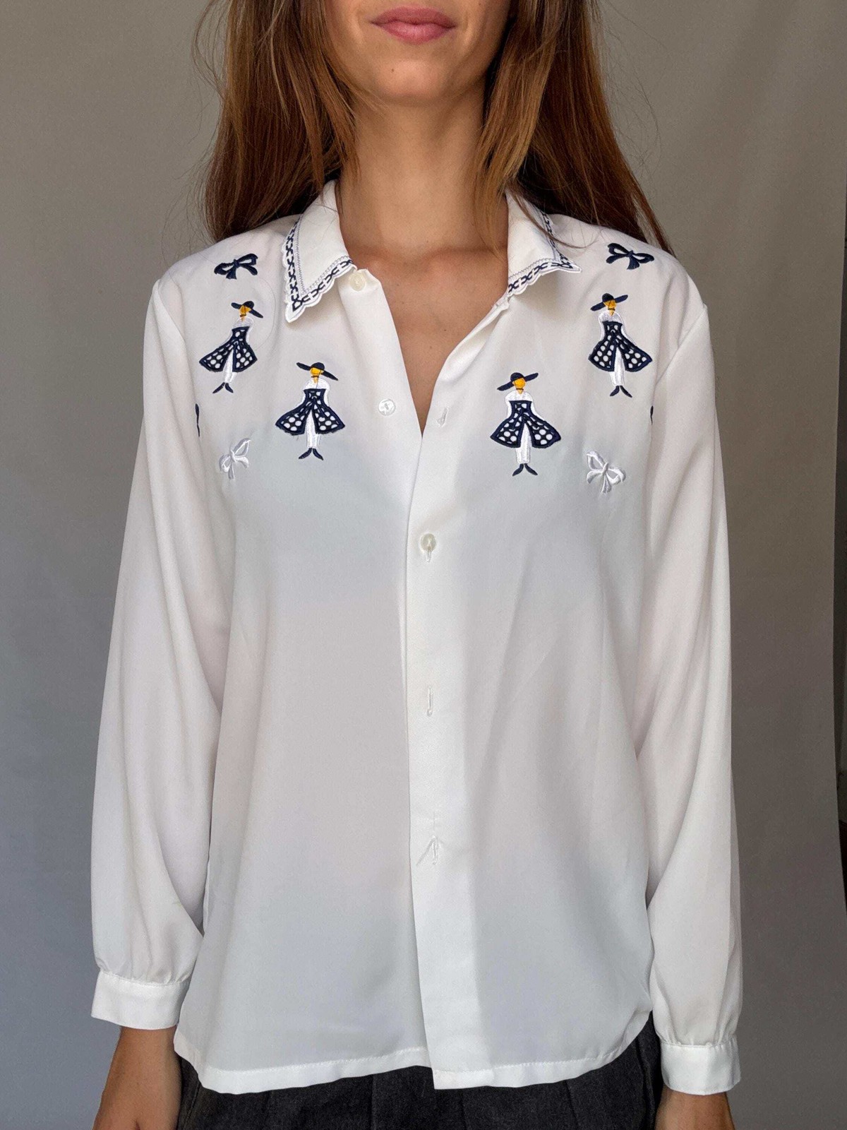 Vintage white embroidered blouse with navy bow and girl motif, US L