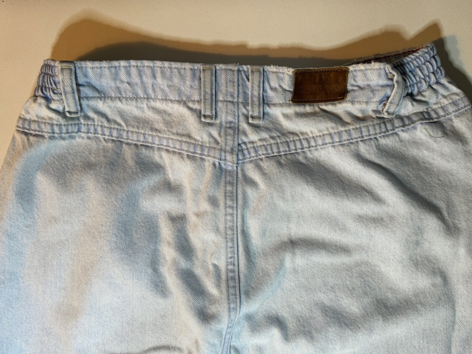 Vintage 1990’s Lee light wash denim jeans, elastic band on each side, 27″ Inseam
