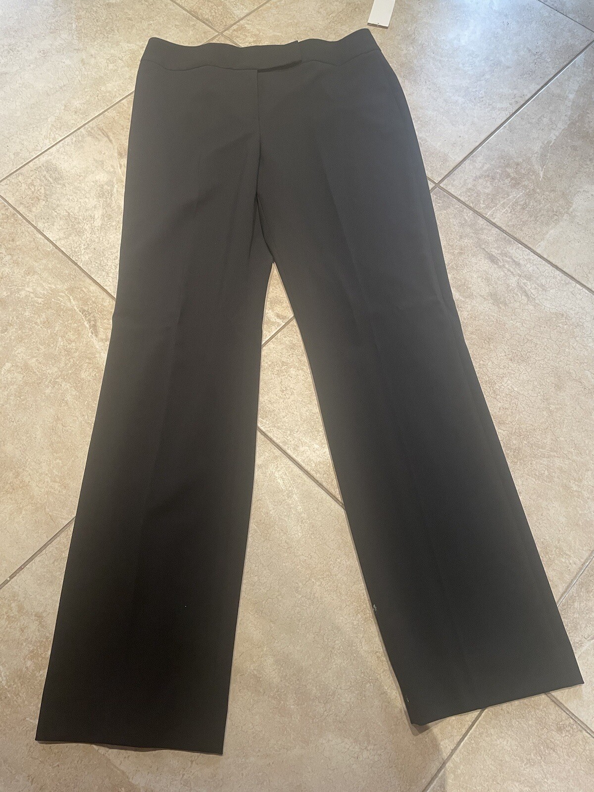 Tahari Arthur S. Levine 2 piece garment, blazer and pants. Size 10. Color black.