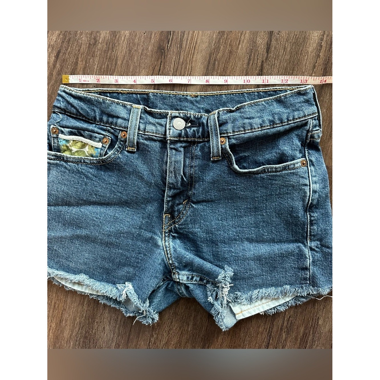 Upcycled Levi’s 511 Cut Off Shorts with Embroidered Pockets. Size 28; Runs Small