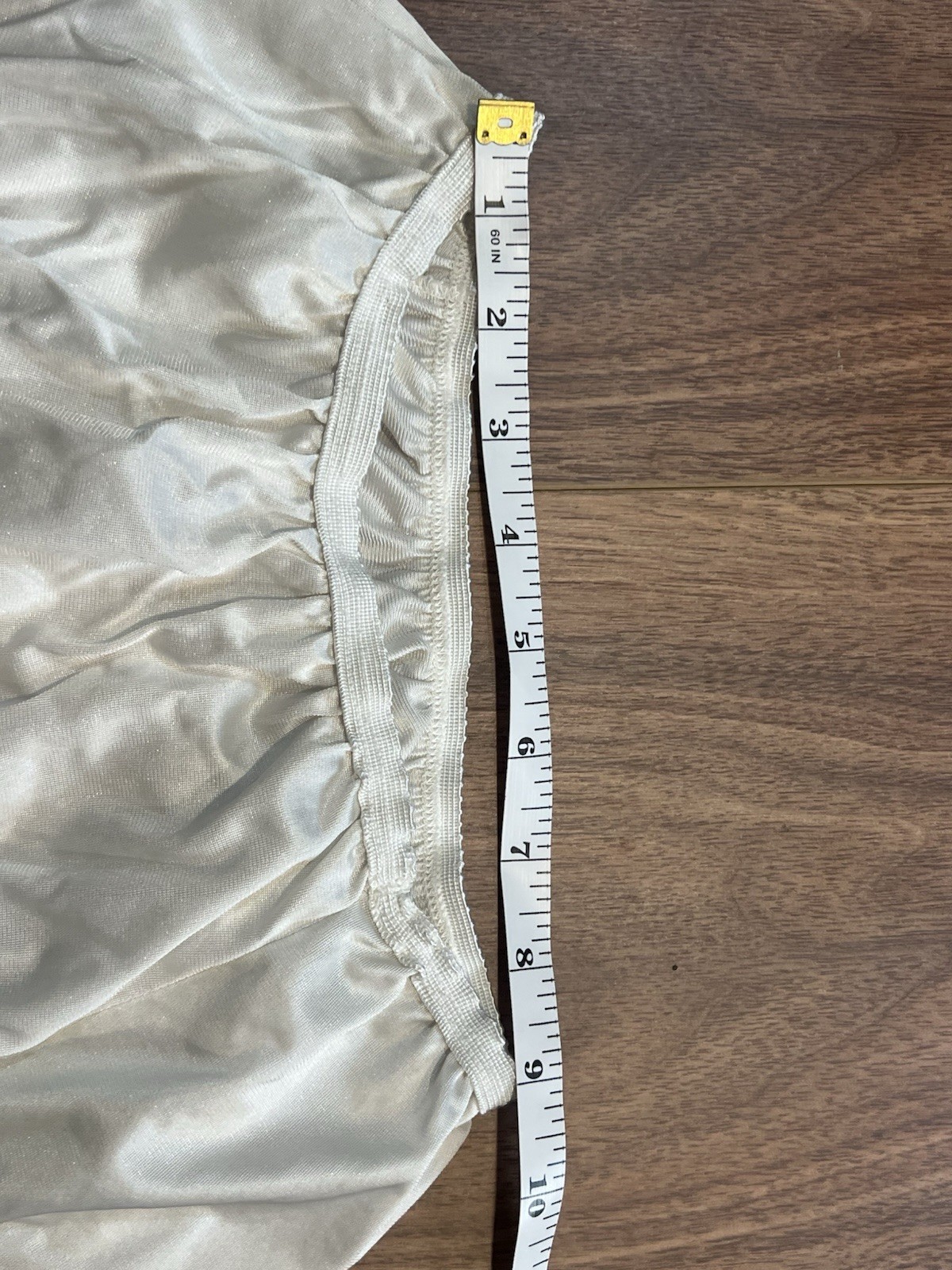 True vintage 1980s white lace trimmed skirt with elastic waistband. Length 25”