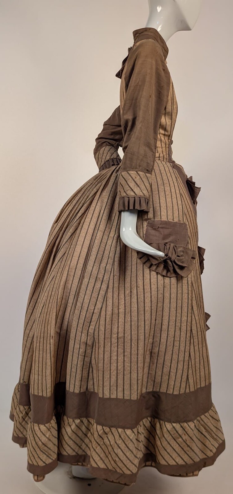 LATE 1860’S PINSTRIPED TAN BOMBAZINE DRESS W BOWS + SIDE POCKET DETAIL