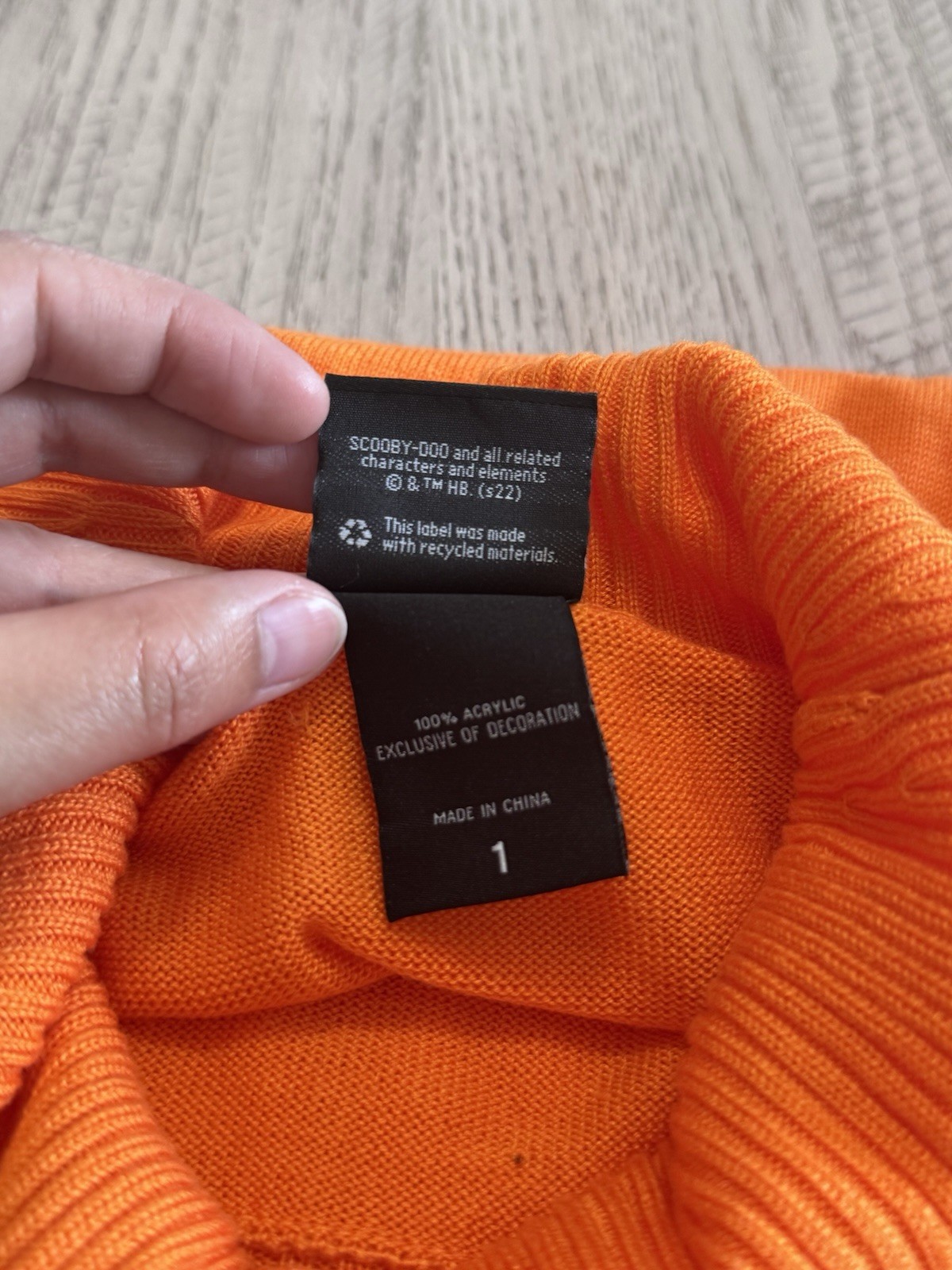 Scooby Doo Velma Turtleneck Pullover Sweater. Acrylic knit fabric. 100% acrylic.