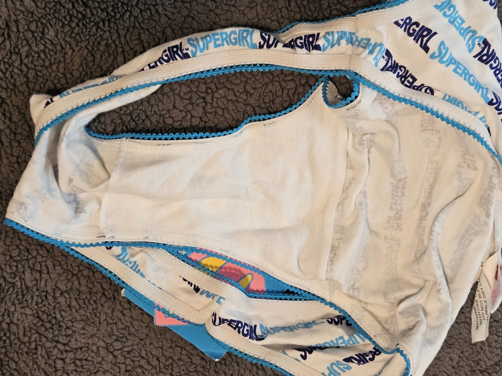 SuperGirl Intimates Women’s Bikini Panties Sz: SMALL Color: WHITE/BLUE WRITING