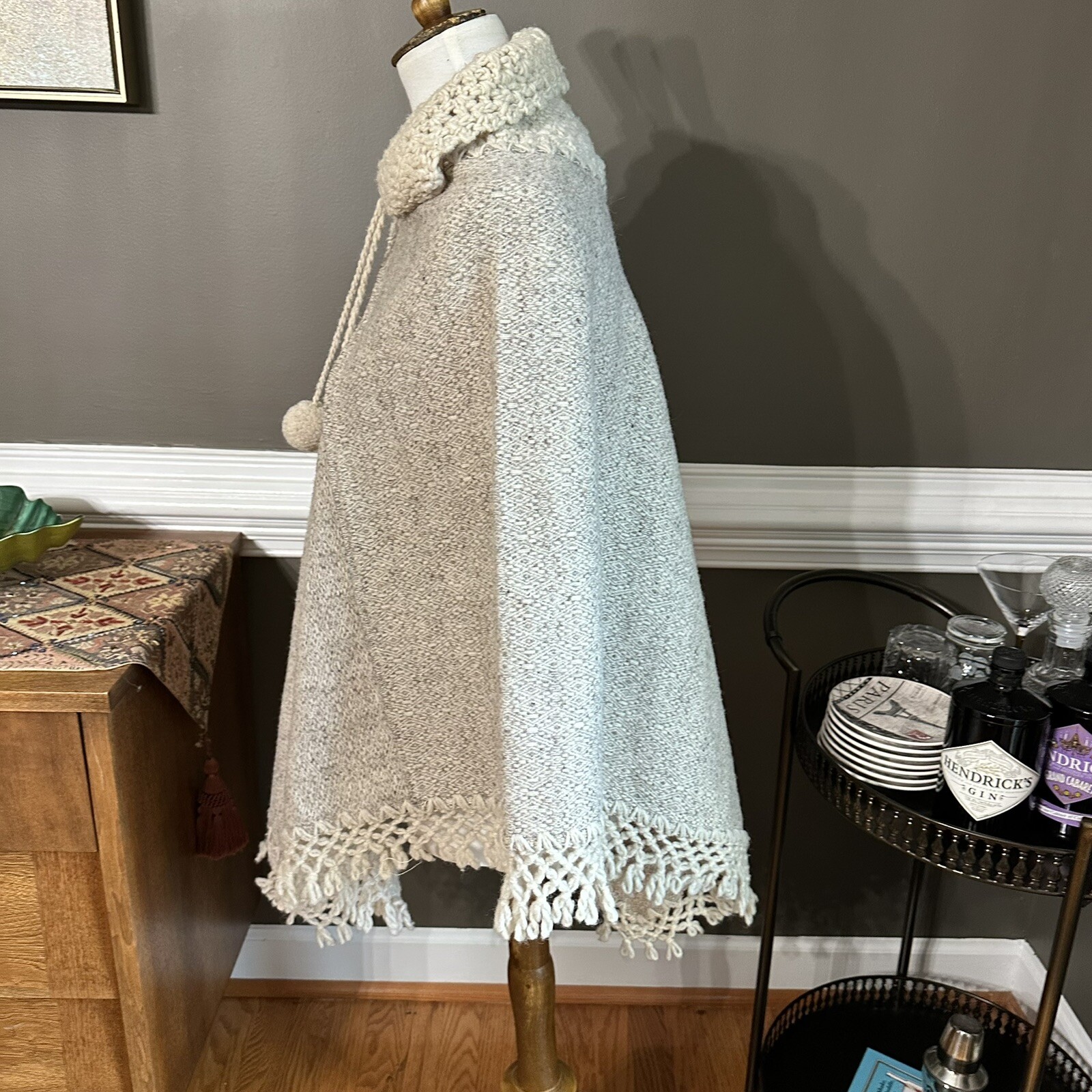 Vintage 1970s Soft and warm cream poncho with hood, tassels, and pom poms