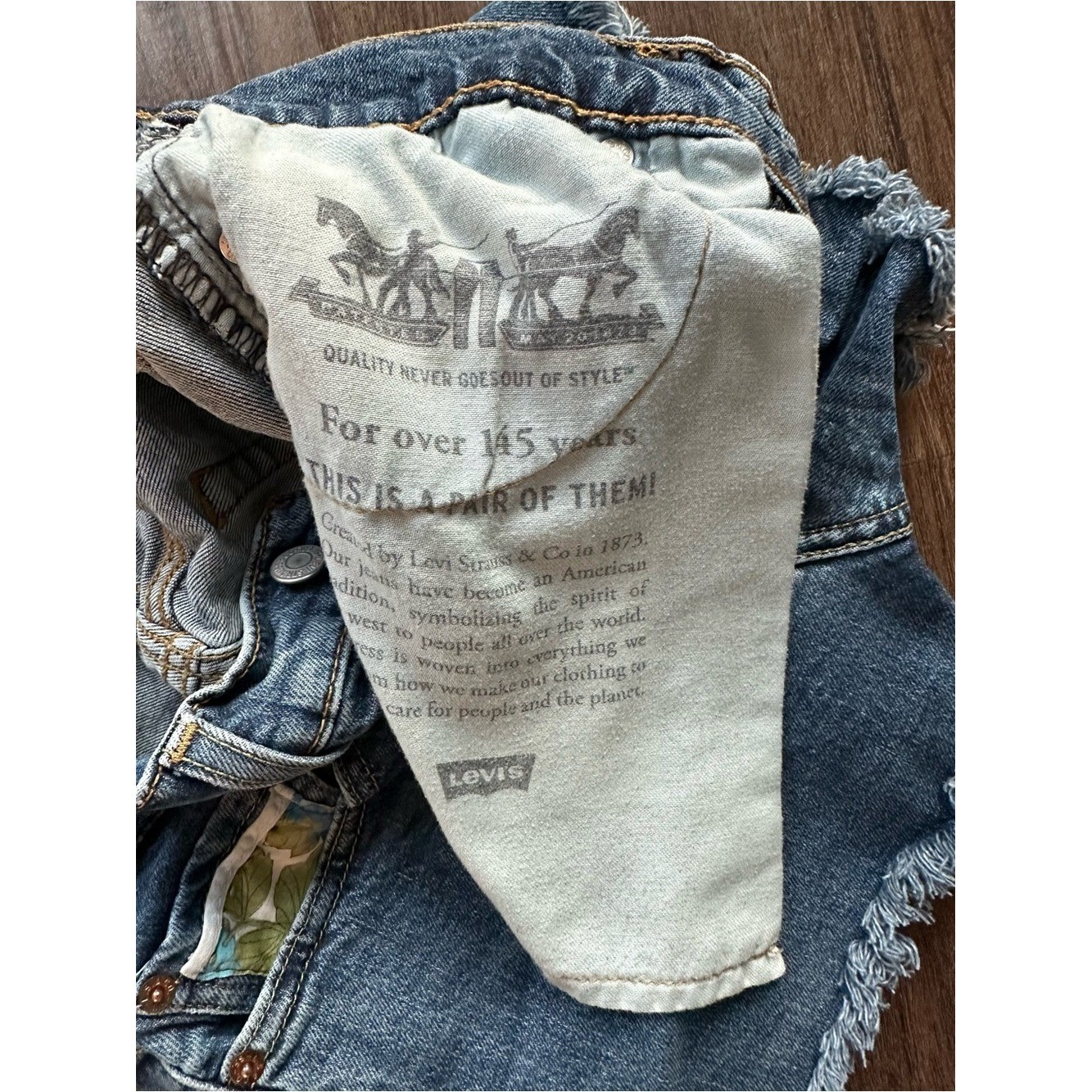 Upcycled Levi’s 511 Cut Off Shorts with Embroidered Pockets. Size 28; Runs Small