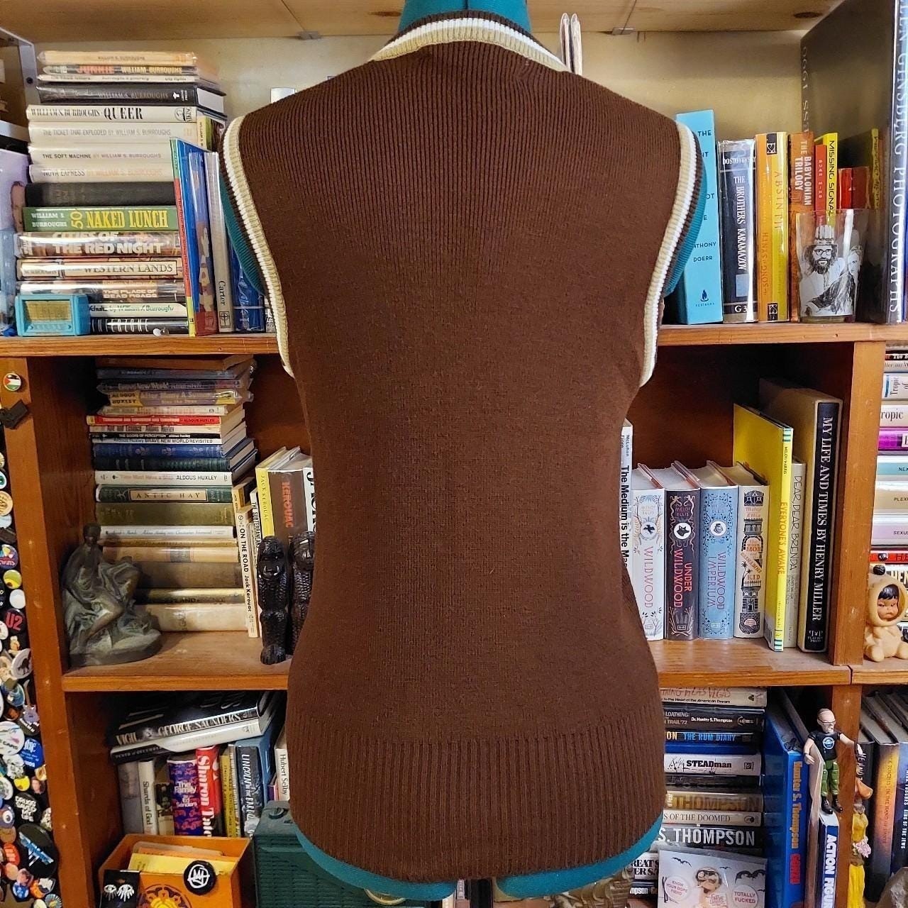 Vintage brown V-neck sweater vest with tan and white details.