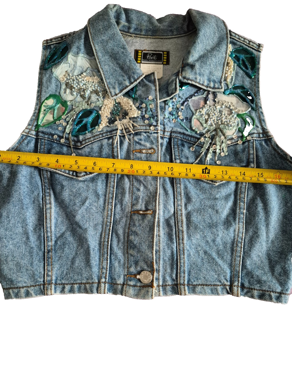 Embellished Denim Vintage 90s cropped fit vest with a light-to-medium wash