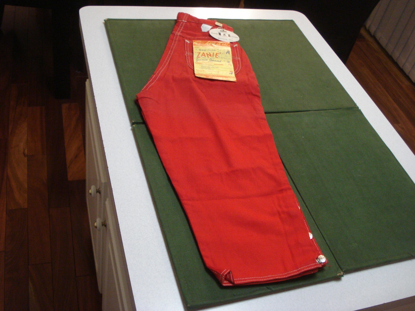 CIRCA 1955 RED JEANS – JANIE JEANS, 3/4 LENGTH, 22″ WAIST, 31″ LENGTH w/TAGS