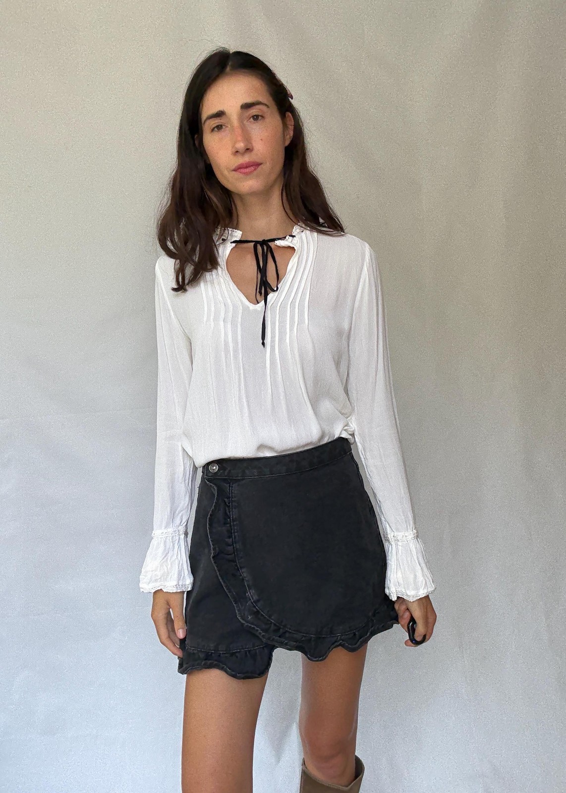 Romantic Bohemian White Blouse with Black Tie Detailing, Flowing Sleeves, and Ru