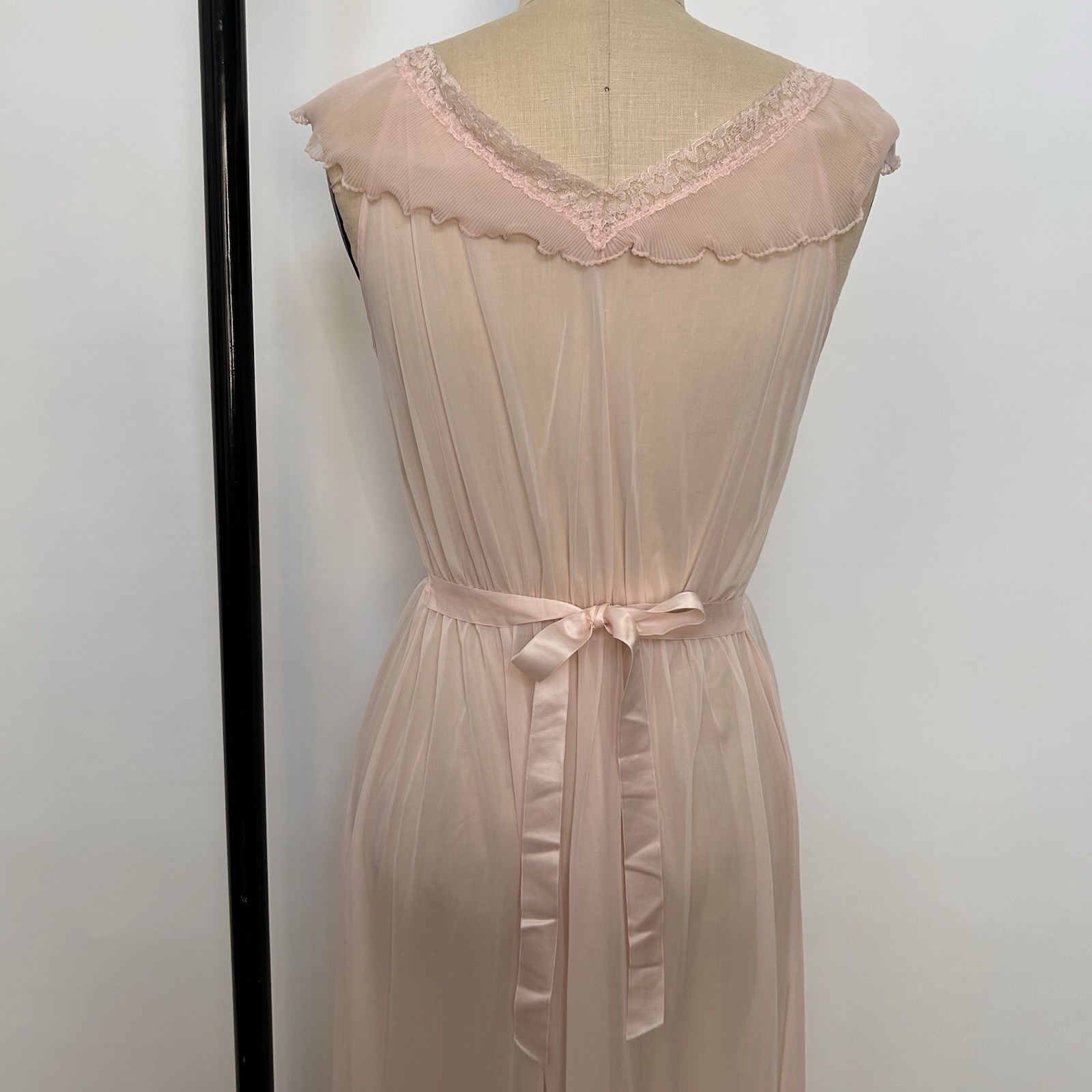 Pink sheer vintage maxi dress with damaged lace trim and ruffle details.