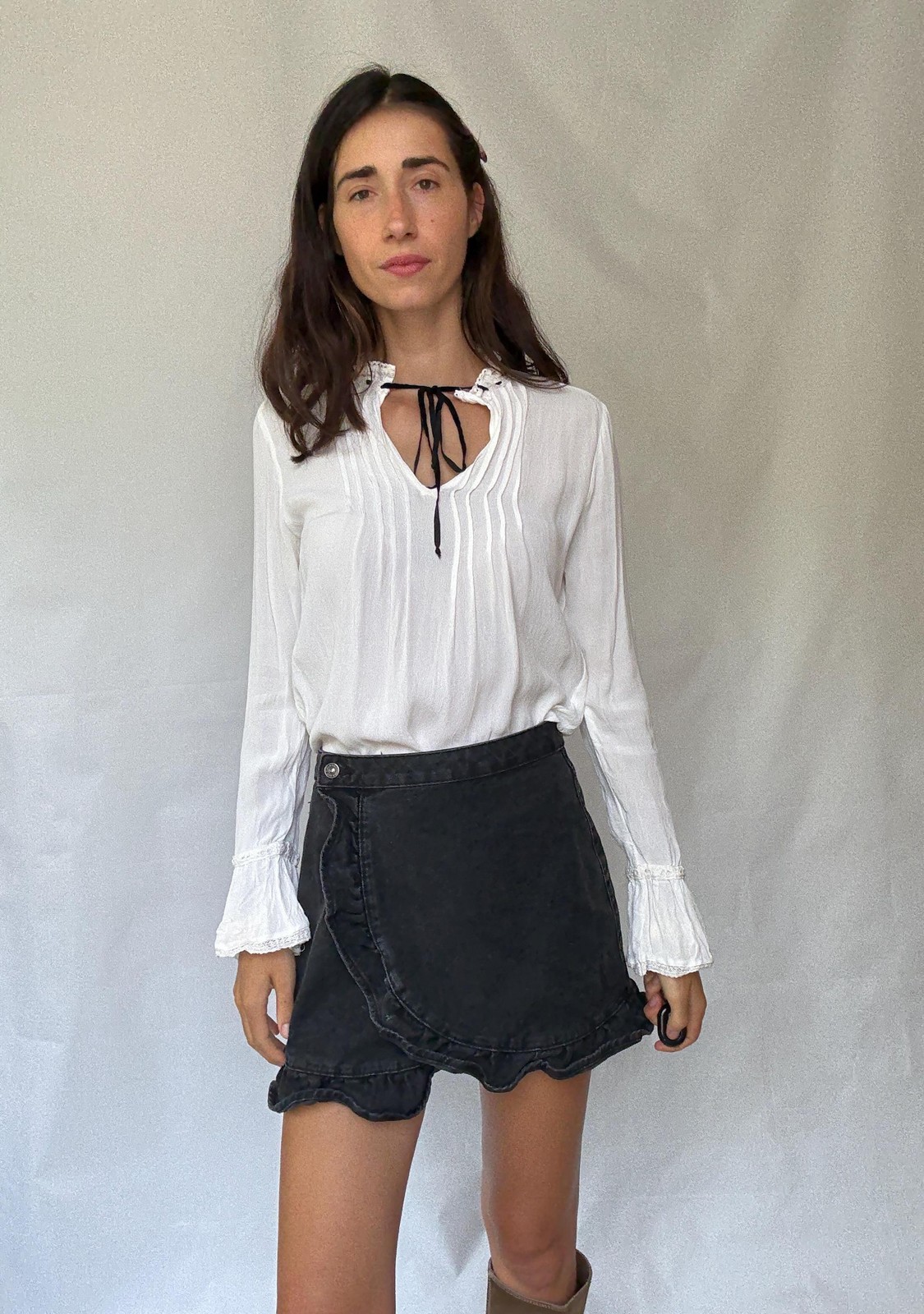 Romantic Bohemian White Blouse with Black Tie Detailing, Flowing Sleeves, and Ru