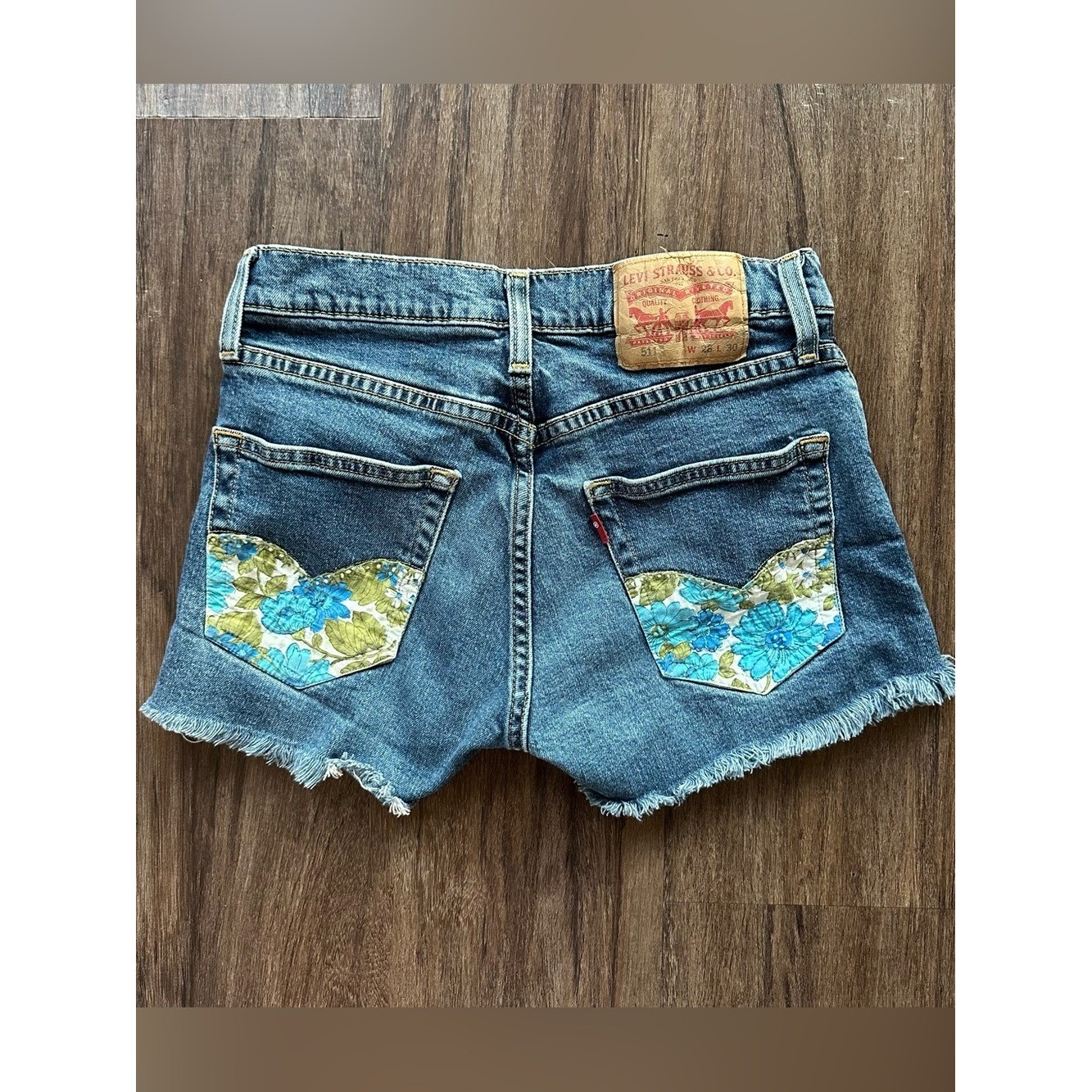 Upcycled Levi’s 511 Cut Off Shorts with Embroidered Pockets. Size 28; Runs Small