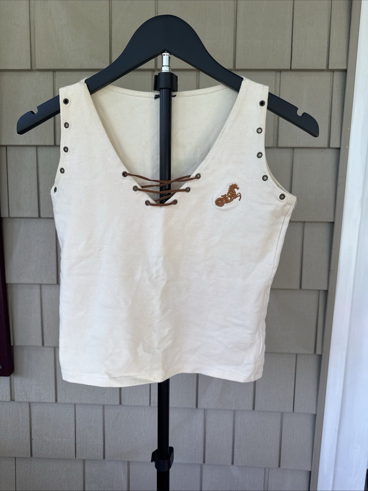Hot Spice Vintage Cream tank with a lace-up V-neck and metal grommet detail Med