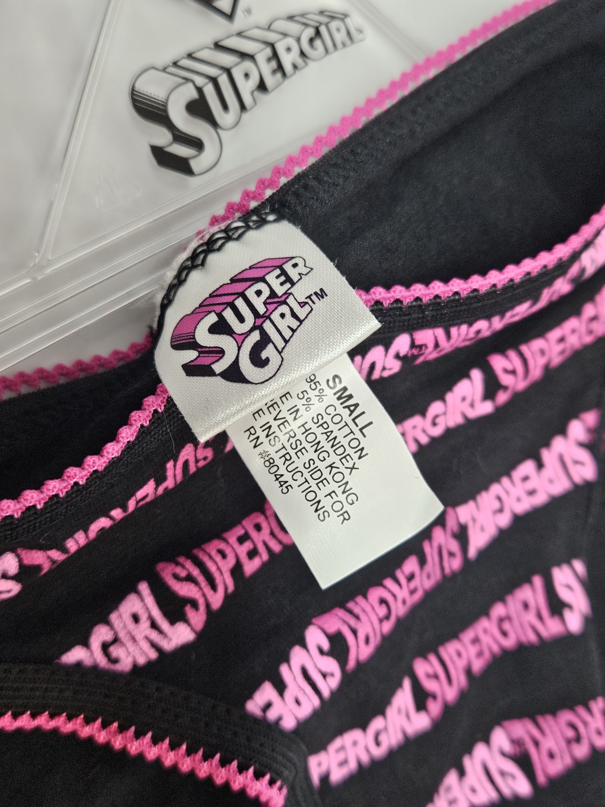 SuperGirl Intimates Women’s Bikini Panties Size: SMALL Color: BLACK/PINK
