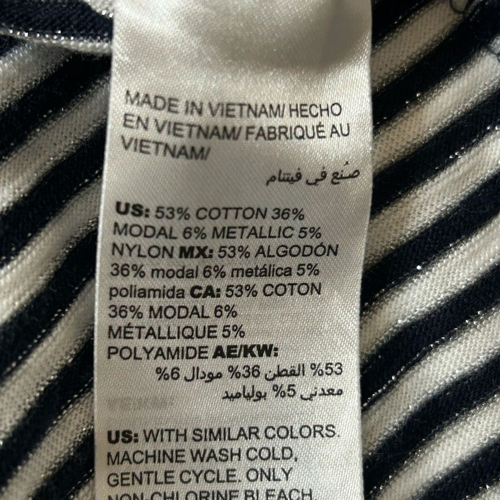 Chico’s women Black and White Striped Top with Metallic Accents.cotton modal .
