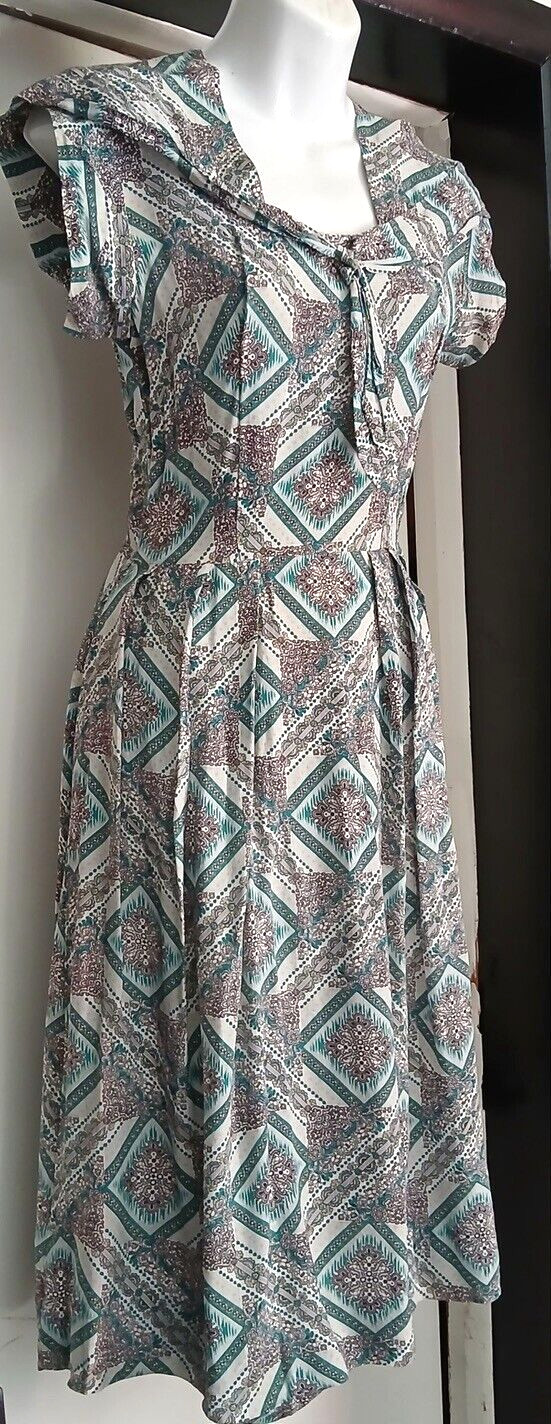 Unique & Flattering 40s handmade Rayon dress with cute tie around neck.Must See!