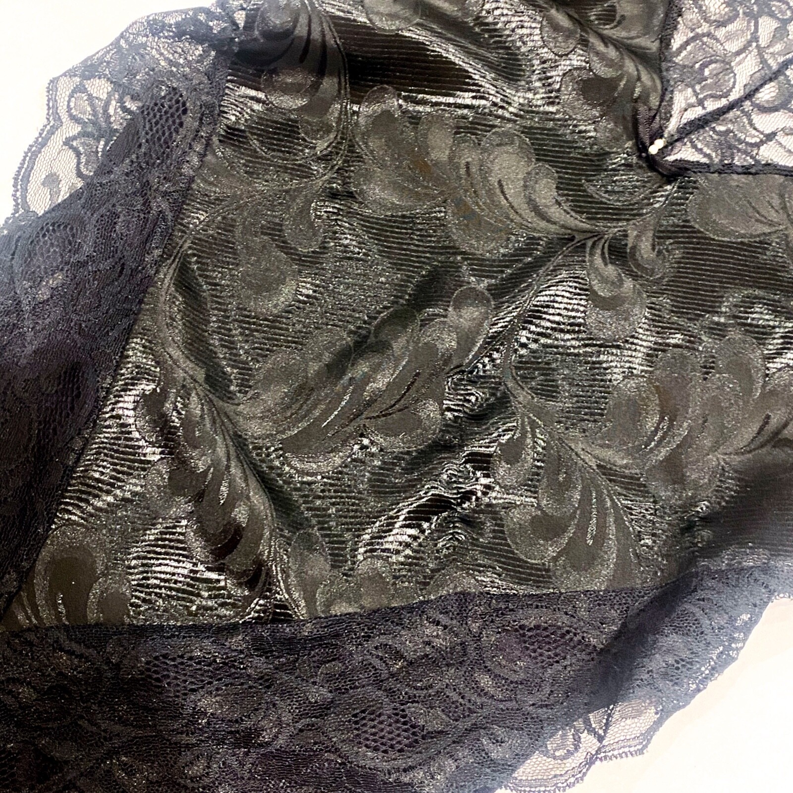 Vintage Lingerie. Black with lace trim and floral print on fabric. Thin spaghett