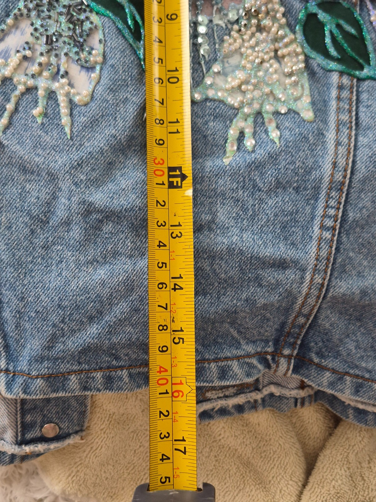 Embellished Denim Vintage 90s cropped fit vest with a light-to-medium wash