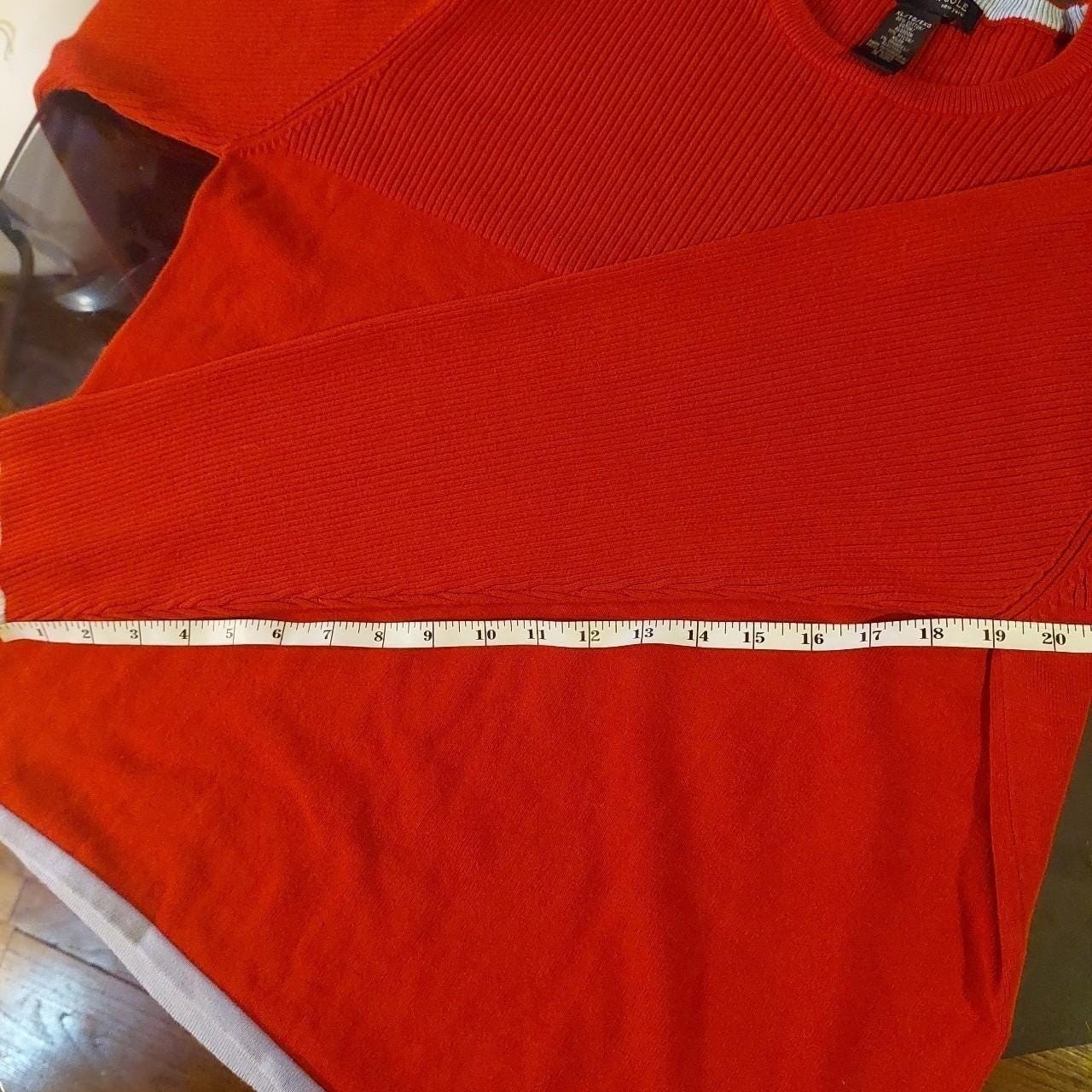 Vintage red sweater with a light blue detailing on the hemline and sleeves.