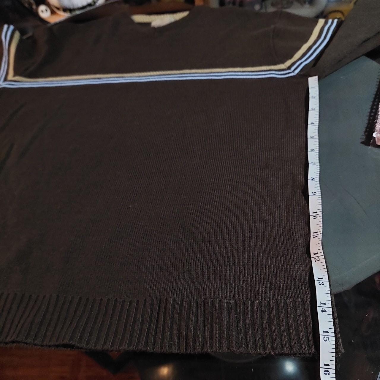Vintage brown, blue, and tan sweater with striped detail.
