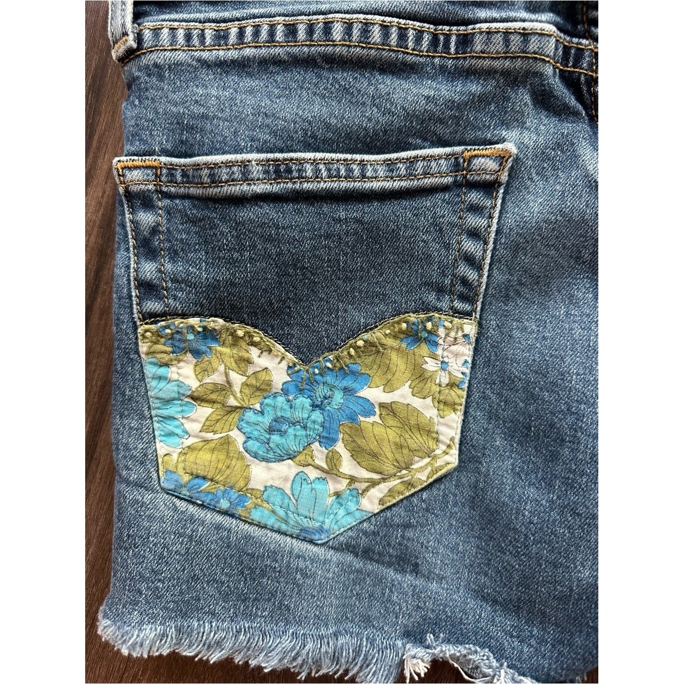 Upcycled Levi’s 511 Cut Off Shorts with Embroidered Pockets. Size 28; Runs Small