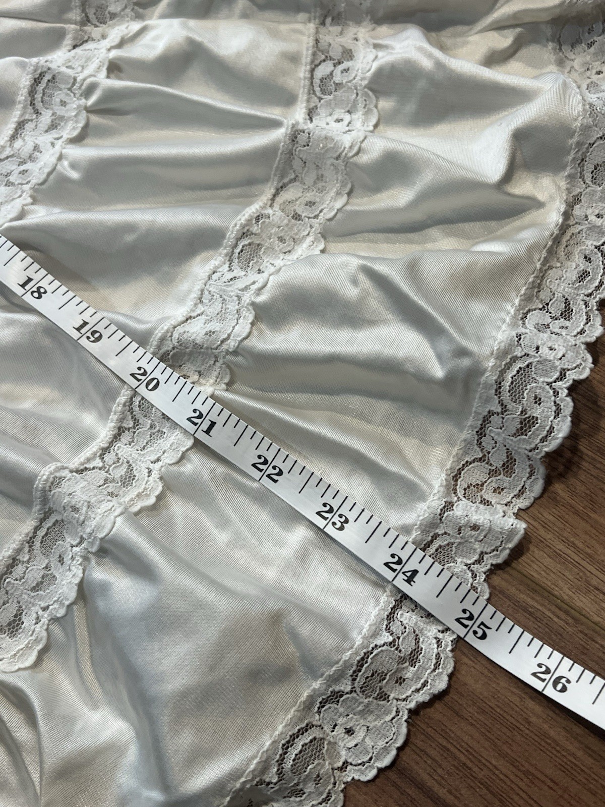 True vintage 1980s white lace trimmed skirt with elastic waistband. Length 25”