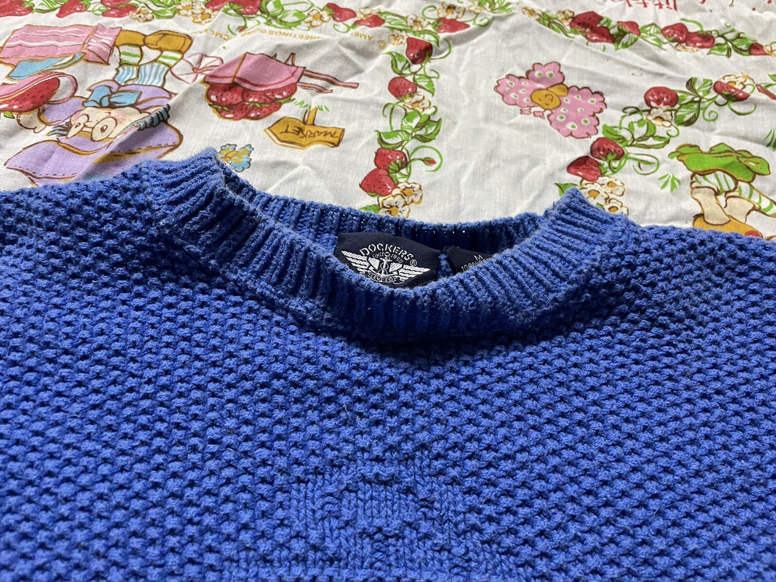 vintage 1980s dockers ladies blue knitted logo symbol sweater. Size medium
