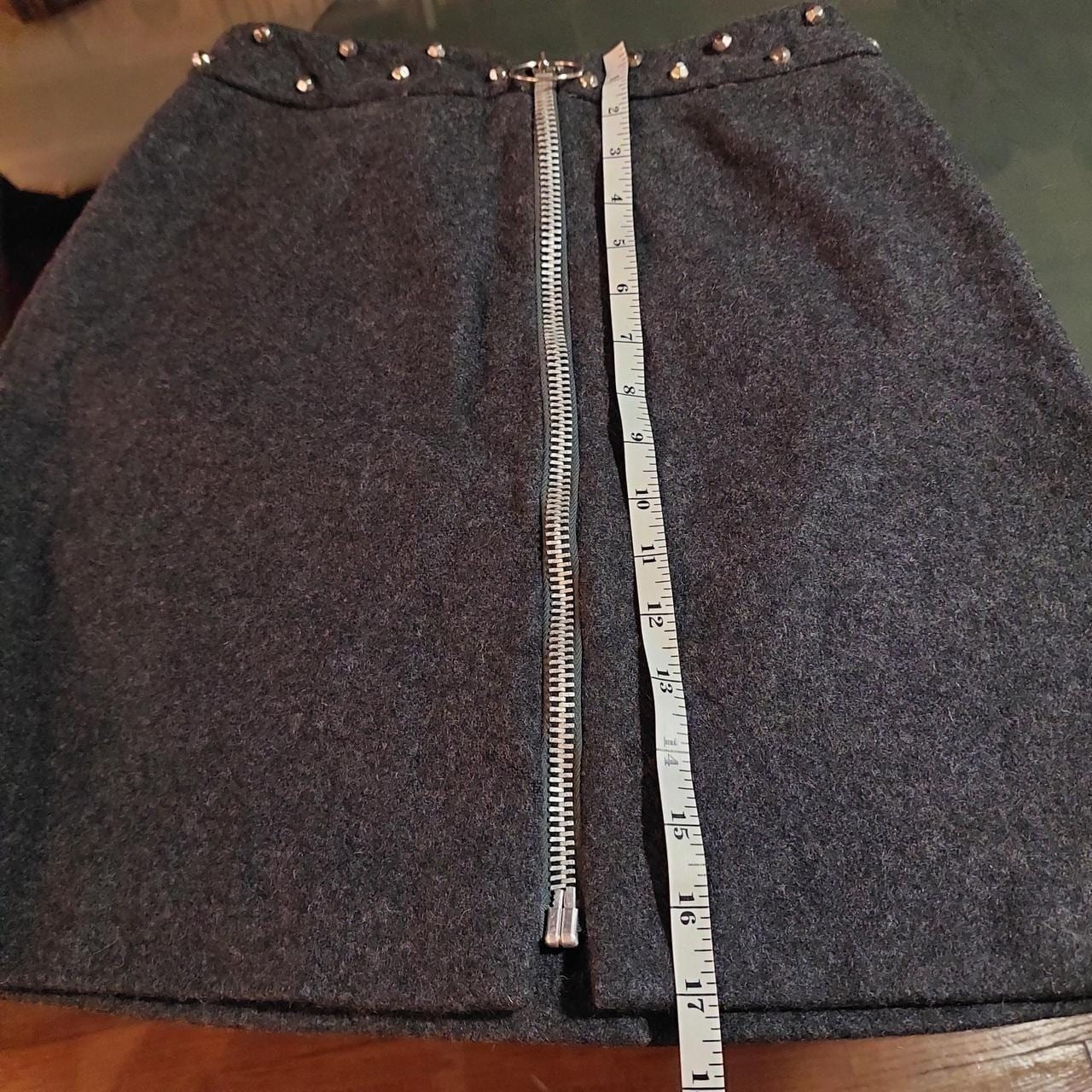 Vintage dark grey mini skirt with metal zipper and metal stud details.