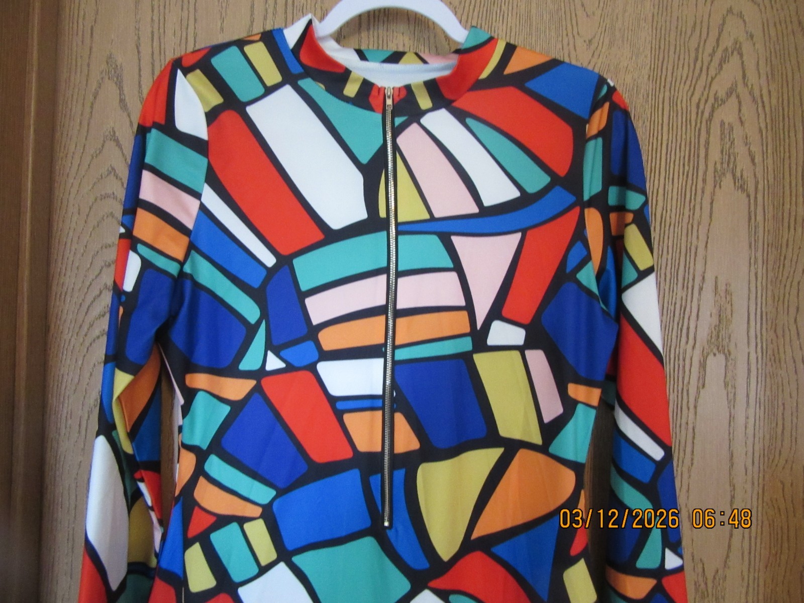 Vintage 60s 70s abstract dress with long sleeves and zippered front.