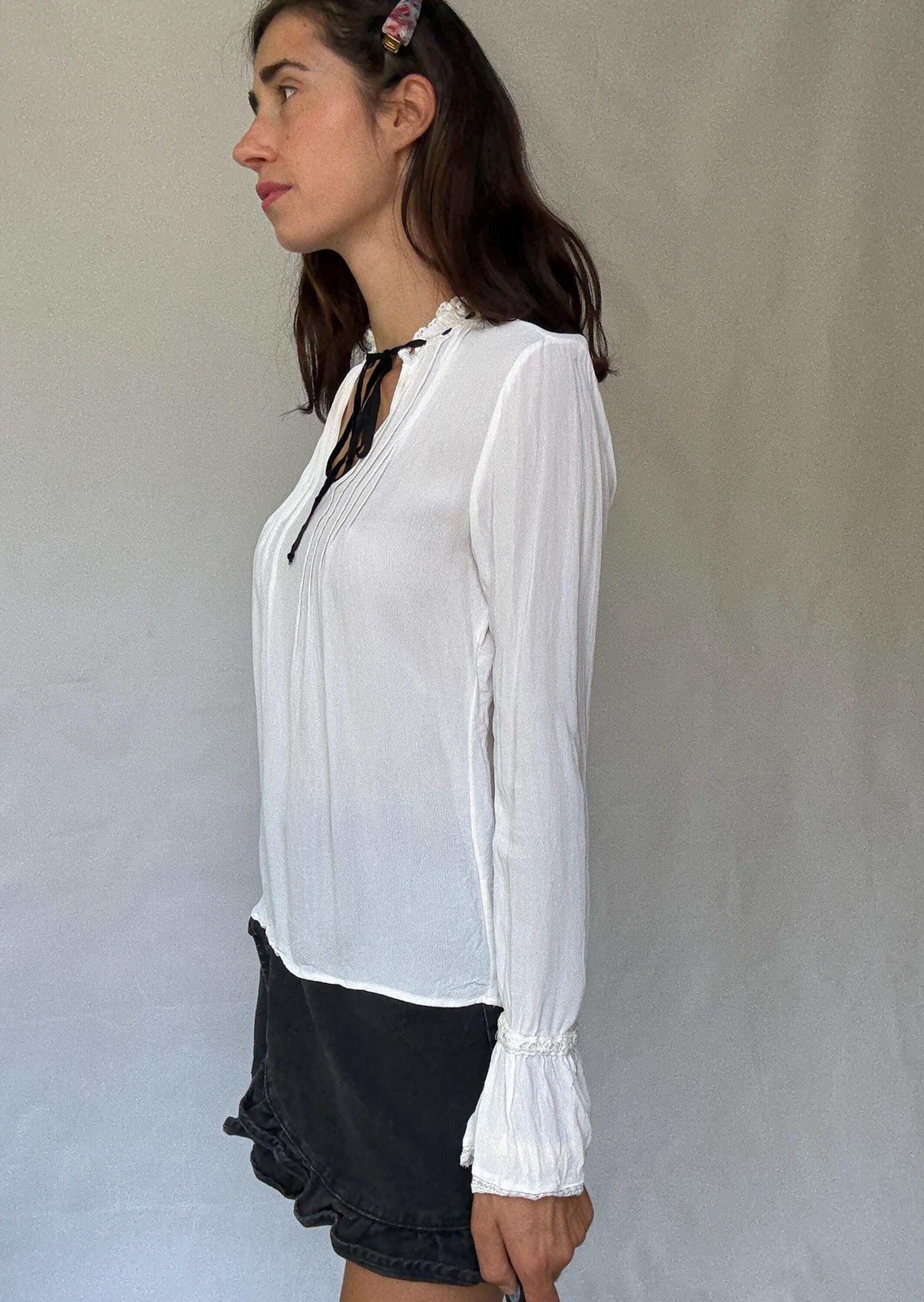 Romantic Bohemian White Blouse with Black Tie Detailing, Flowing Sleeves, and Ru