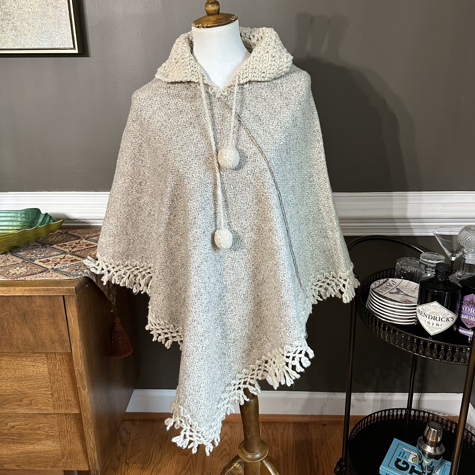 Vintage 1970s Soft and warm cream poncho with hood, tassels, and pom poms
