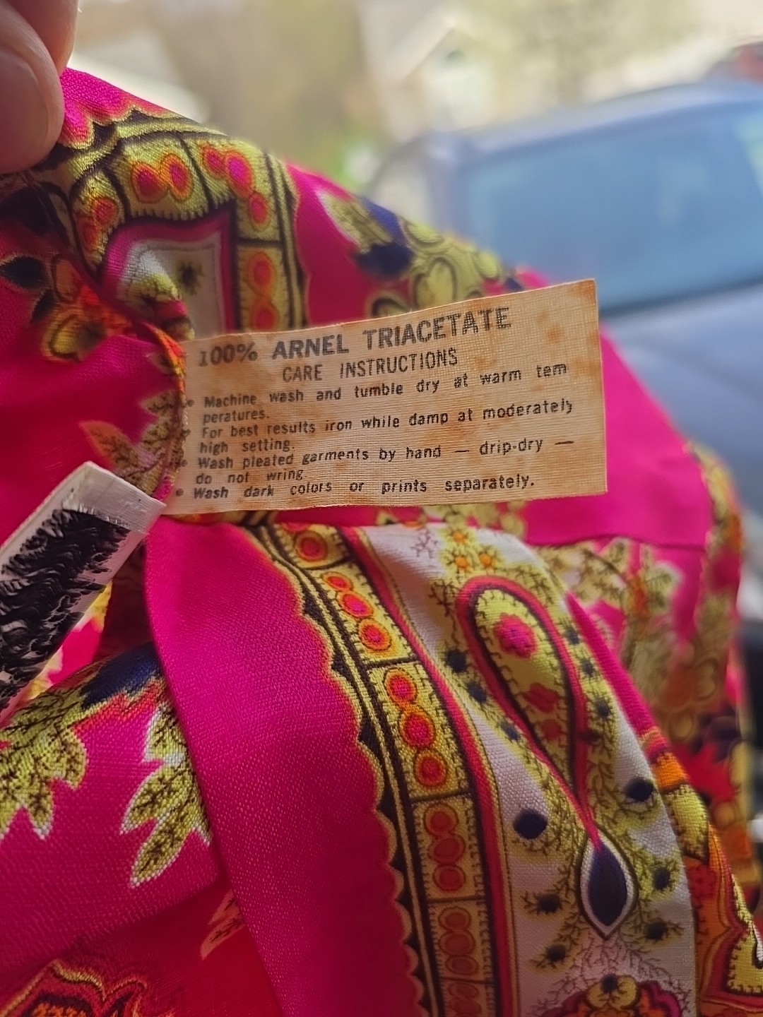 This vibrant piece is from the vintage brand Timely Fashions of Miami