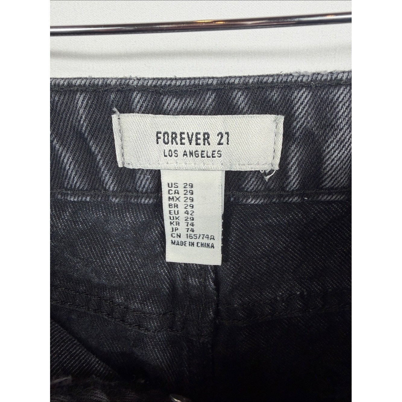 Forever 21 Black Distressed High-Rise Denim Shorts. Paint mark on back. Size 29