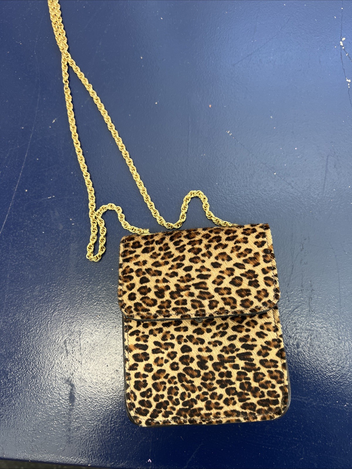 This is a St. Maarten Dallas Leopard Mini Crossbody