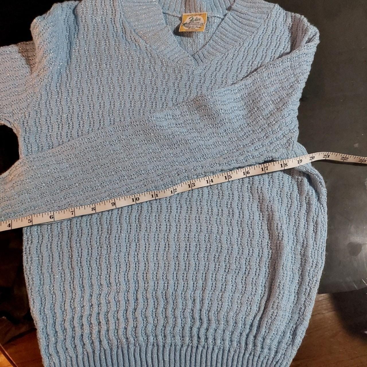 Vintage baby blue and silver metallic sweater.