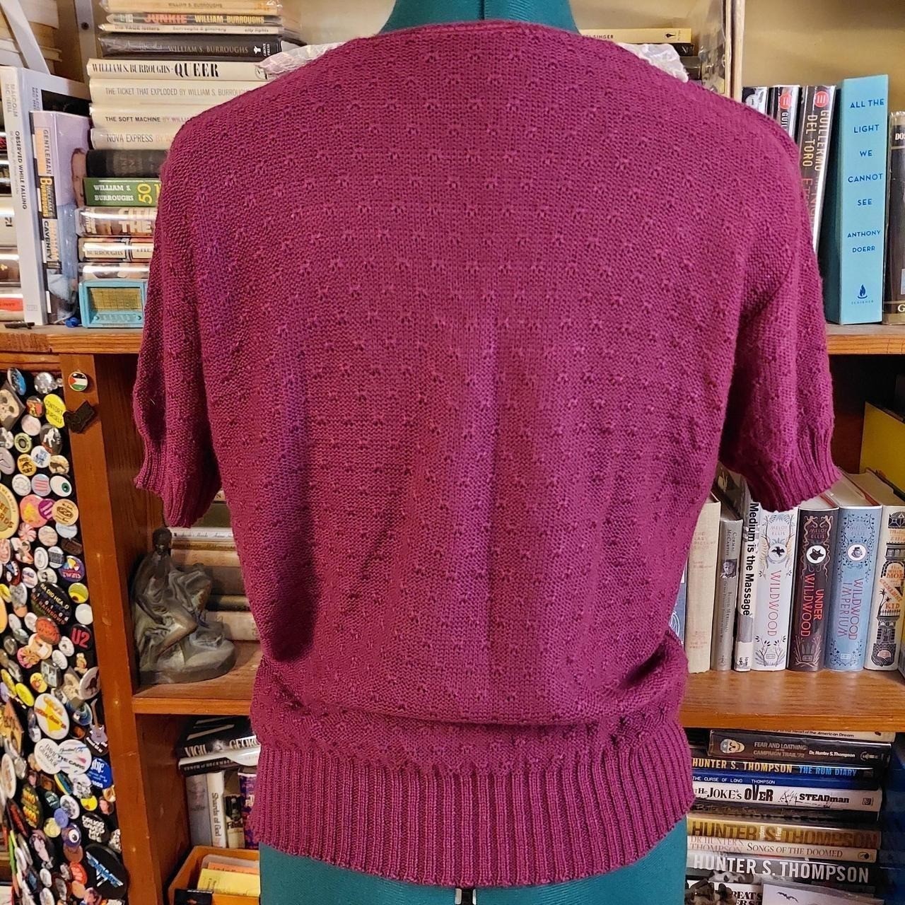 Vintage short sleeve reddish purple sweater with lace collar detail.