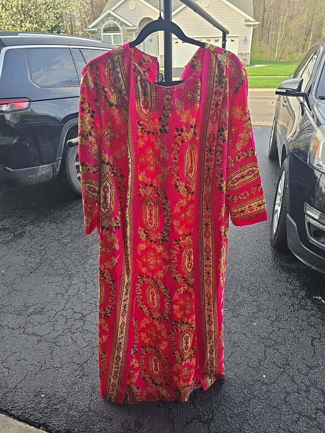 This vibrant piece is from the vintage brand Timely Fashions of Miami