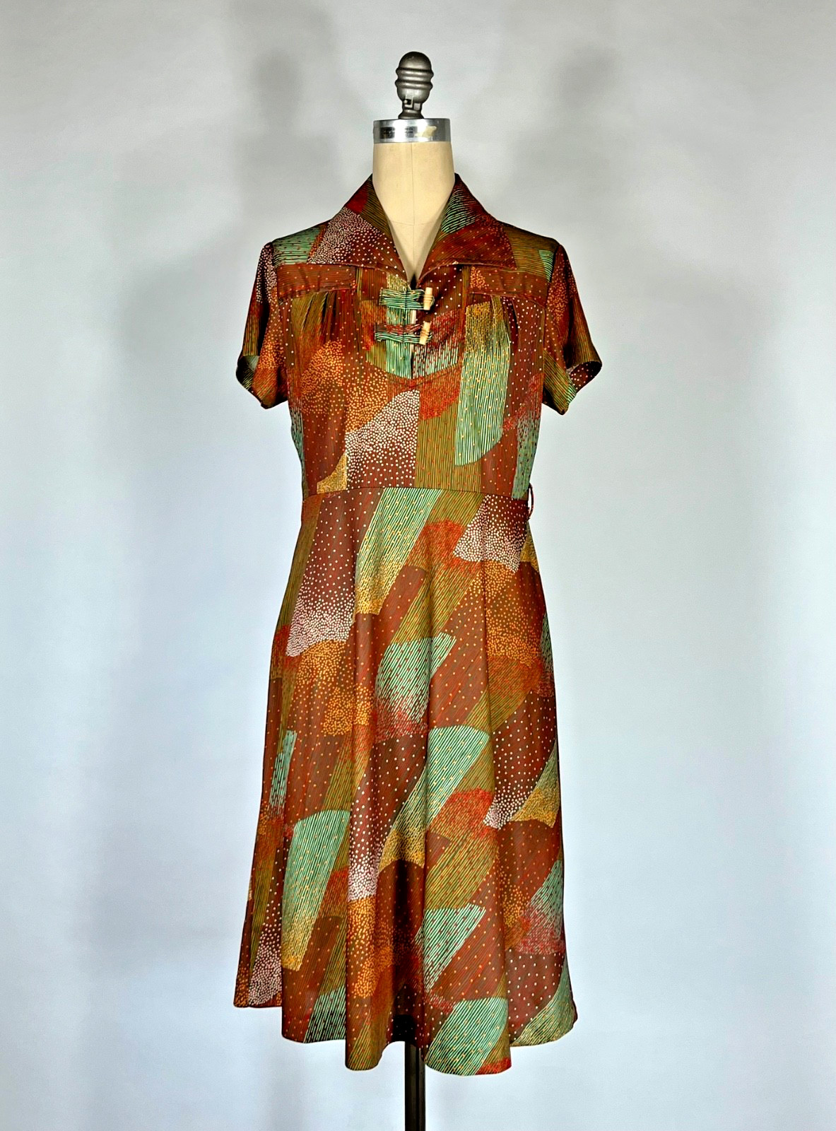 Vintage 1970’s lightweight nylon knit earth tone abstract print day dress Medium