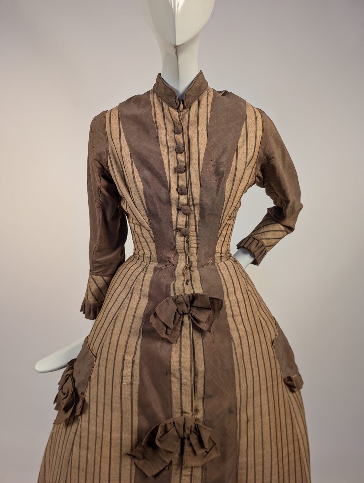 LATE 1860’S PINSTRIPED TAN BOMBAZINE DRESS W BOWS + SIDE POCKET DETAIL