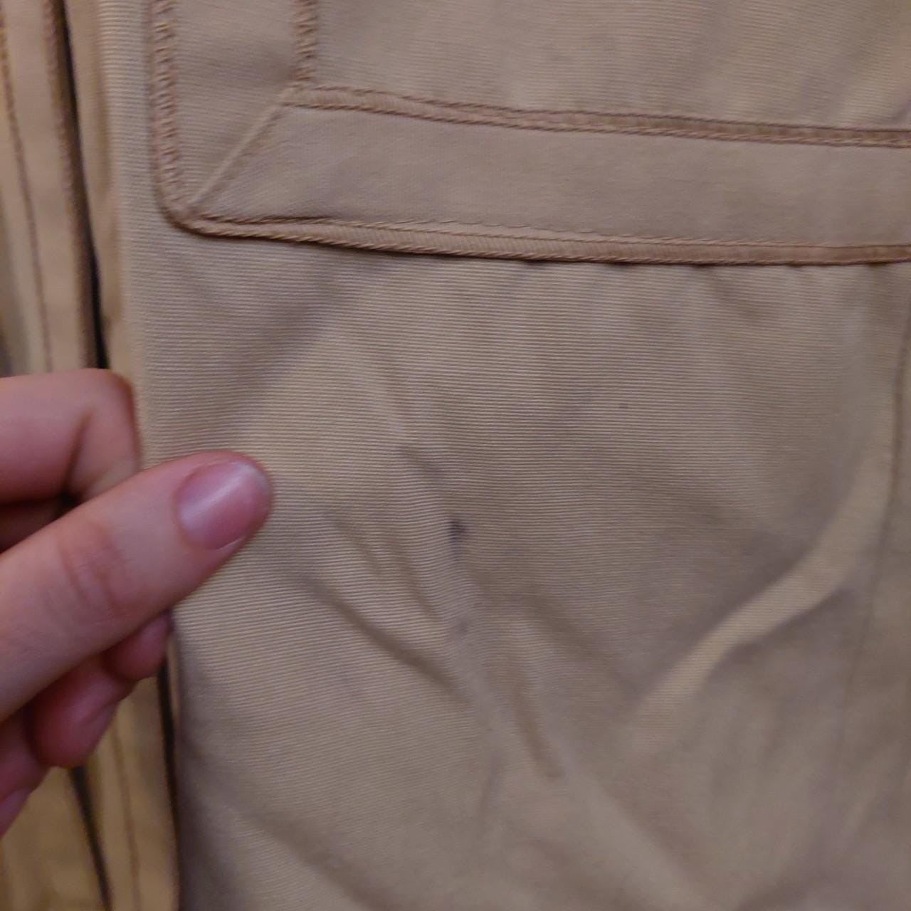 Vintage tan 1970s trench coat.