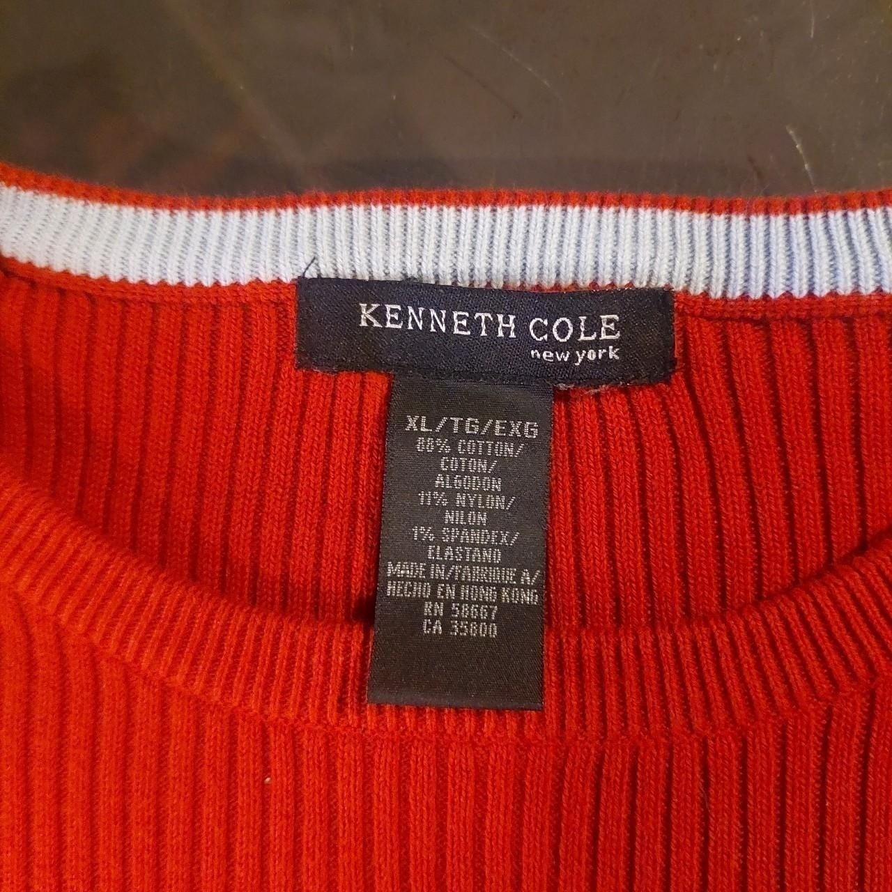 Vintage red sweater with a light blue detailing on the hemline and sleeves.