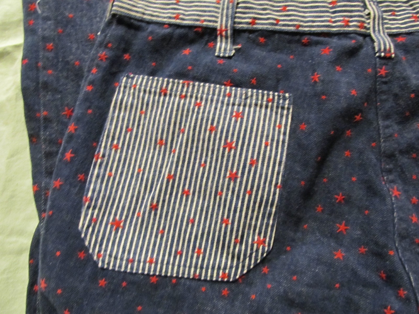Vintage 1960’s denim with red stars & sailor button fly hip-hugger jeans/ pants