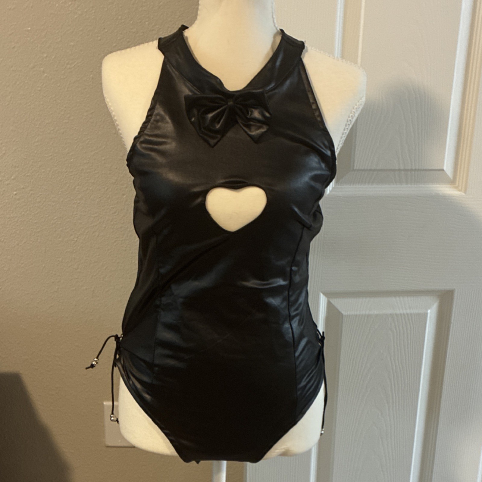 Black One Piece Women’s Bodysuit with Bow and Heart Cutout Accents