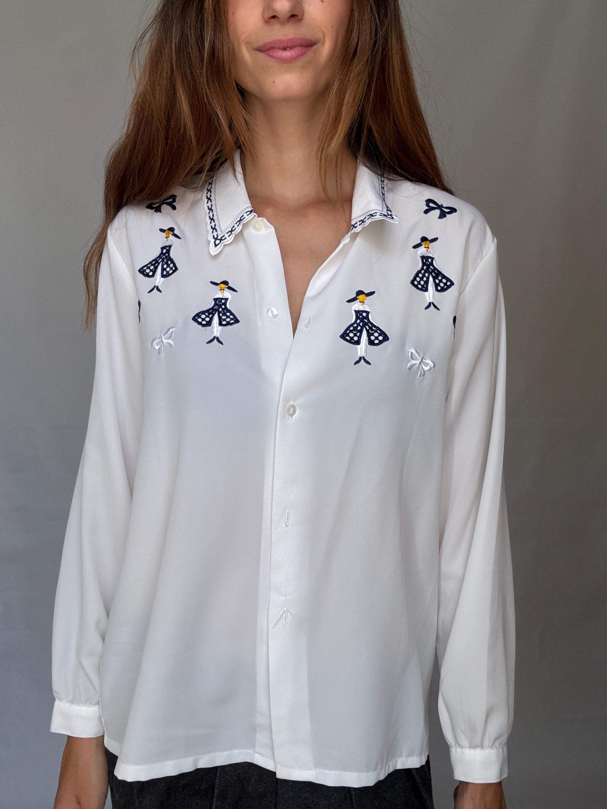Vintage white embroidered blouse with navy bow and girl motif, US L