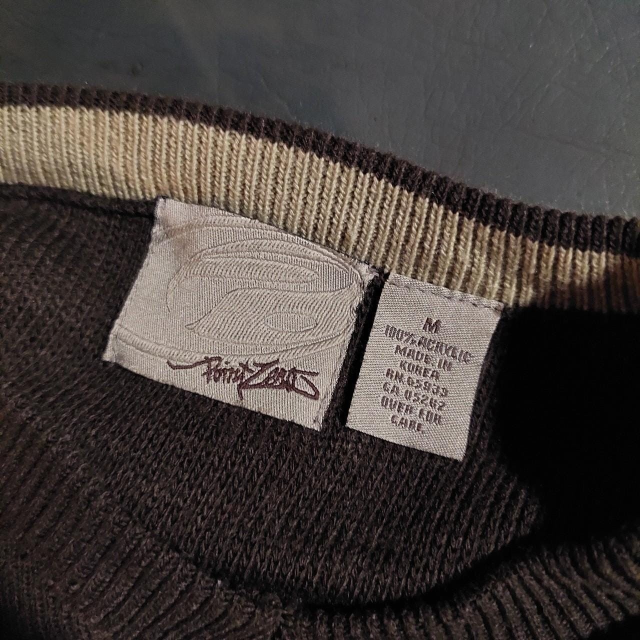 Vintage brown, blue, and tan sweater with striped detail.