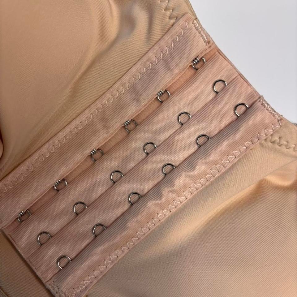 Beige strapless corset top bra with adjustable straps and hooks. Size: S