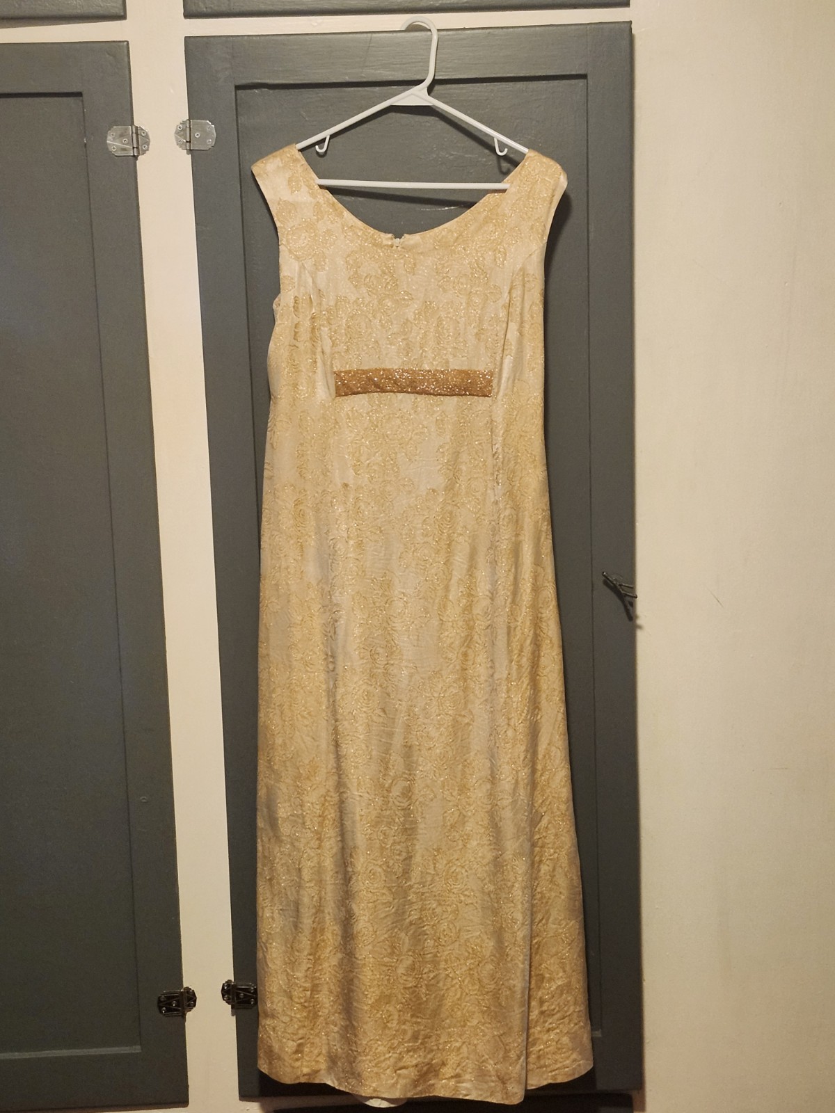 1960s gold floral brocade maxi dress featuring a scoop neckline Size S